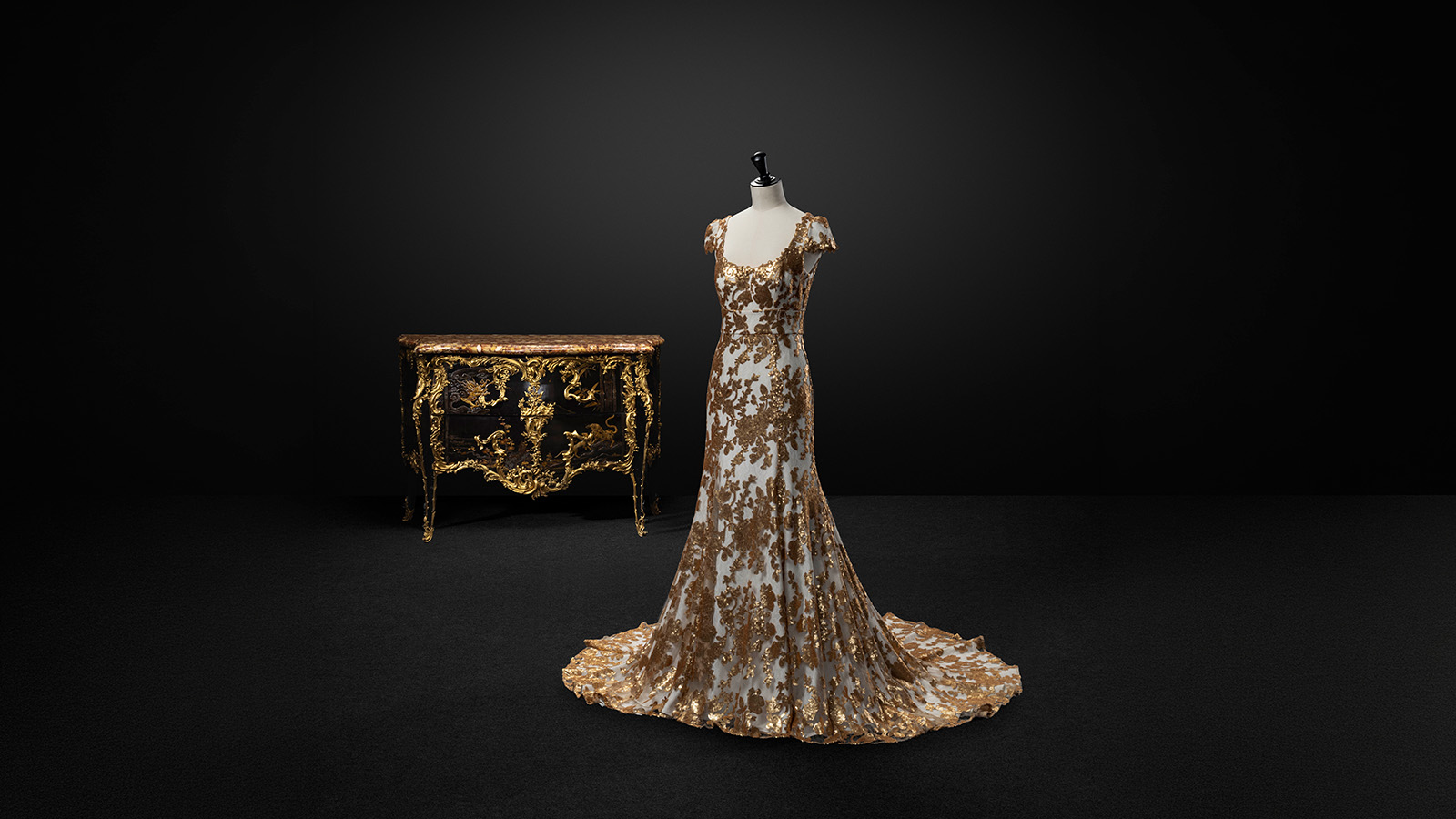 Jean Deforges Commode Paris, c. 1750–55 Oak and ebony, Japanese lacquer; bronze and marble Calouste Gulbenkian Museum, inv. 284 Nuno Baltazar Dress Portugal, 2016 Artificial tulle and fiber mesh and sequins MMP, EPE/Museu Nacional do Traje, Lisbon. 38787 Calouste Gulbenkian Foundation. Photo: © Jon Cazenave