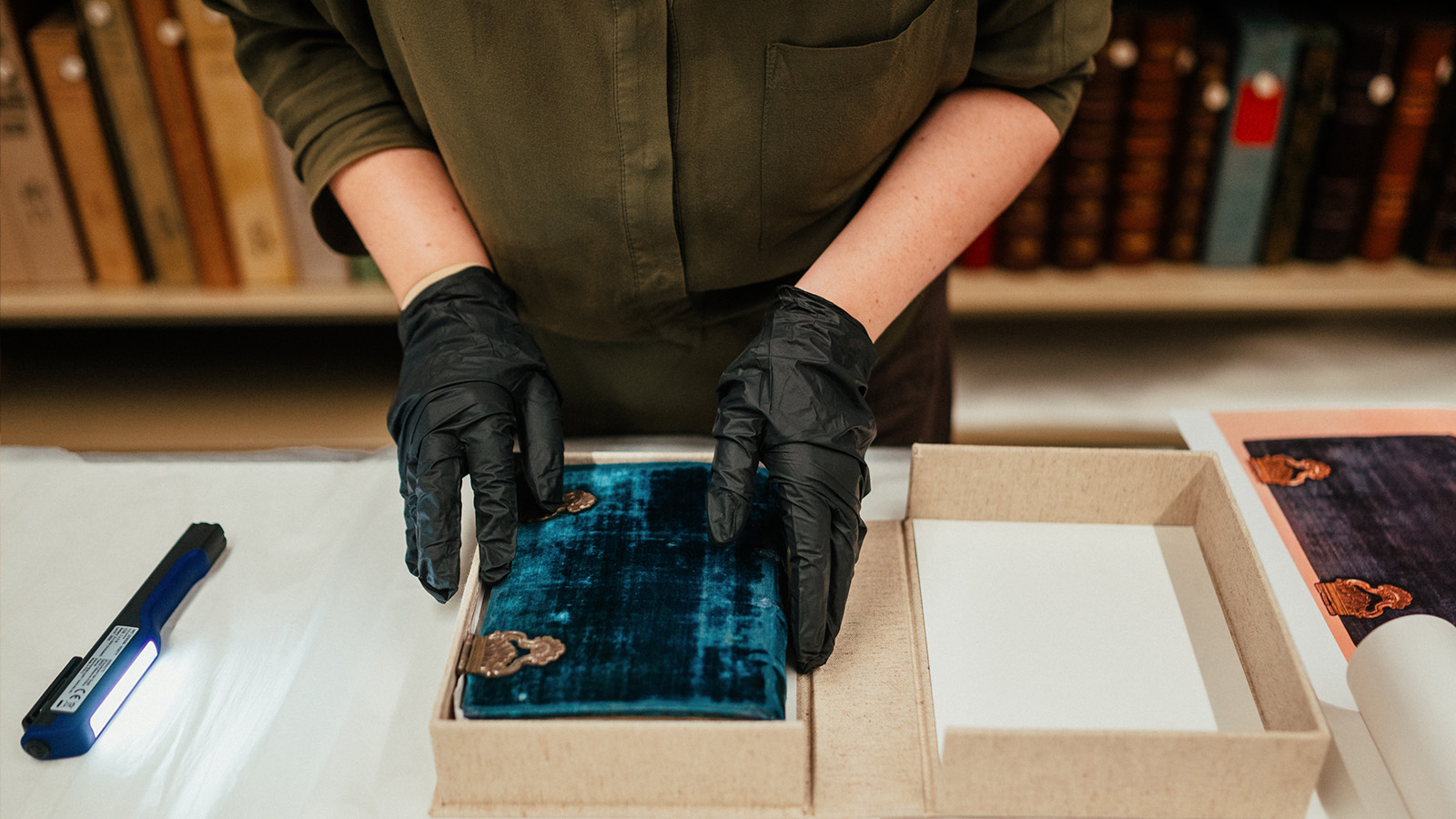 Curator Ana Maria Campino during the process of assessing the condition of a European illuminated manuscript © Pedro Pina