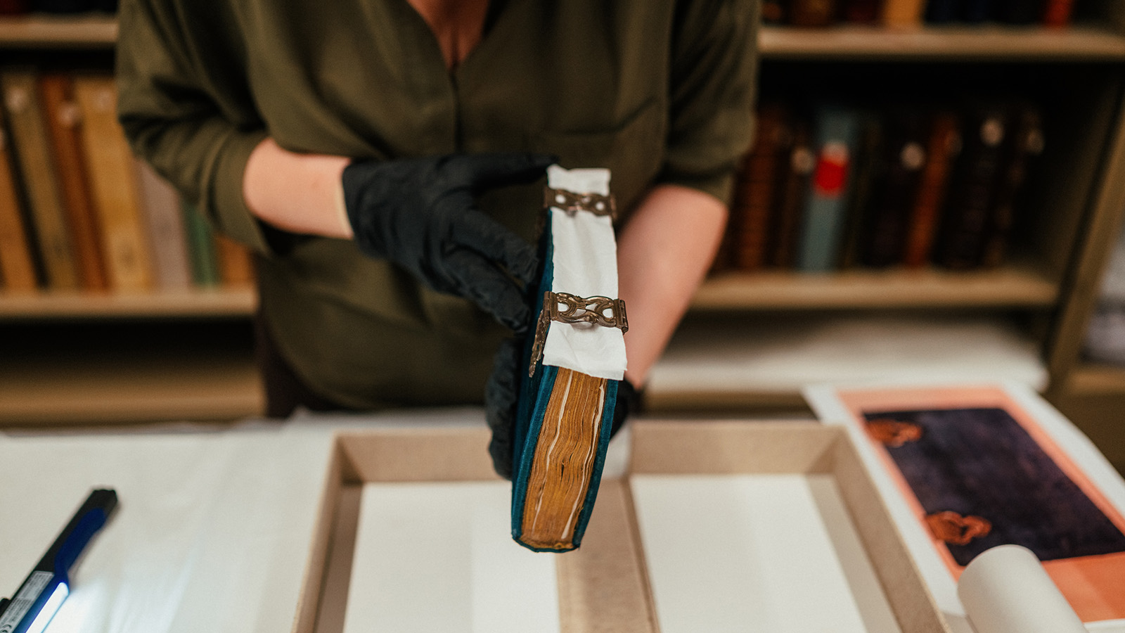 Curator Ana Maria Campino during the process of assessing the condition of a European illuminated manuscript © Pedro Pina